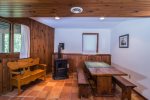 Family room in walkout basement with pellet stove for cozy winter evenings after skiing